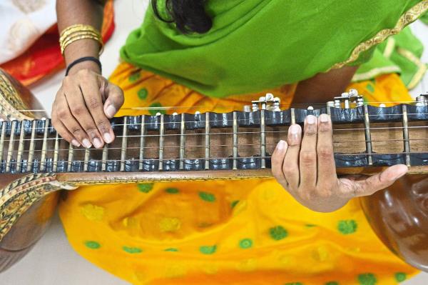 Made from solid wood, the veena requires precise finger techniques. 