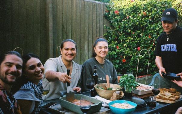 Shea Wātene, co-founder of Brown Town, among some of the community in Christchurch.